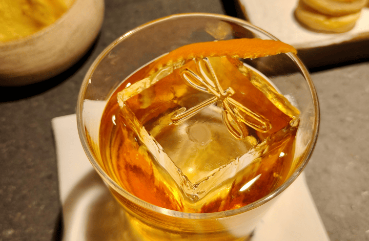 Old fashioned cocktail with a pretty print on the ice cube