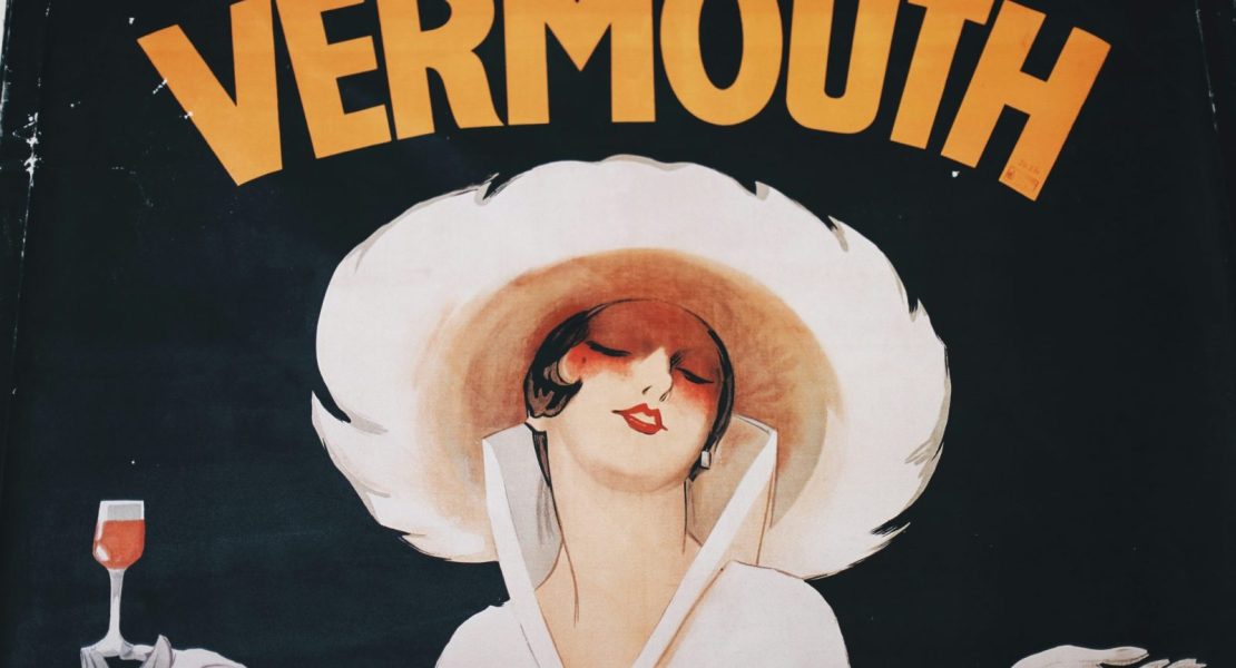 old style vermouth posted with a woman holding a glass