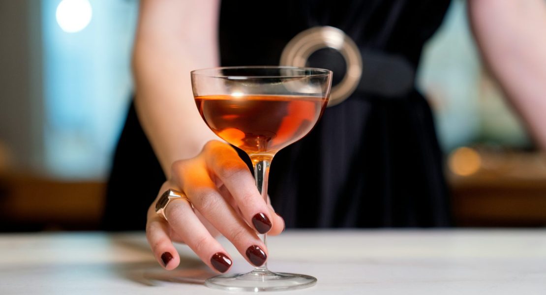 woman serving a cocktail