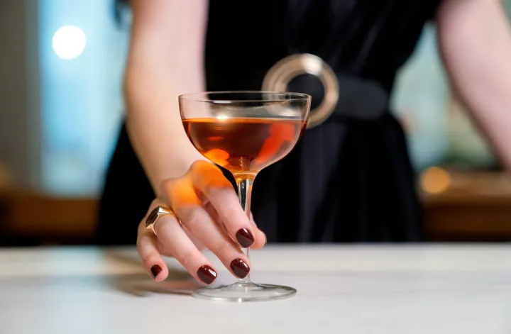 woman serving a cocktail