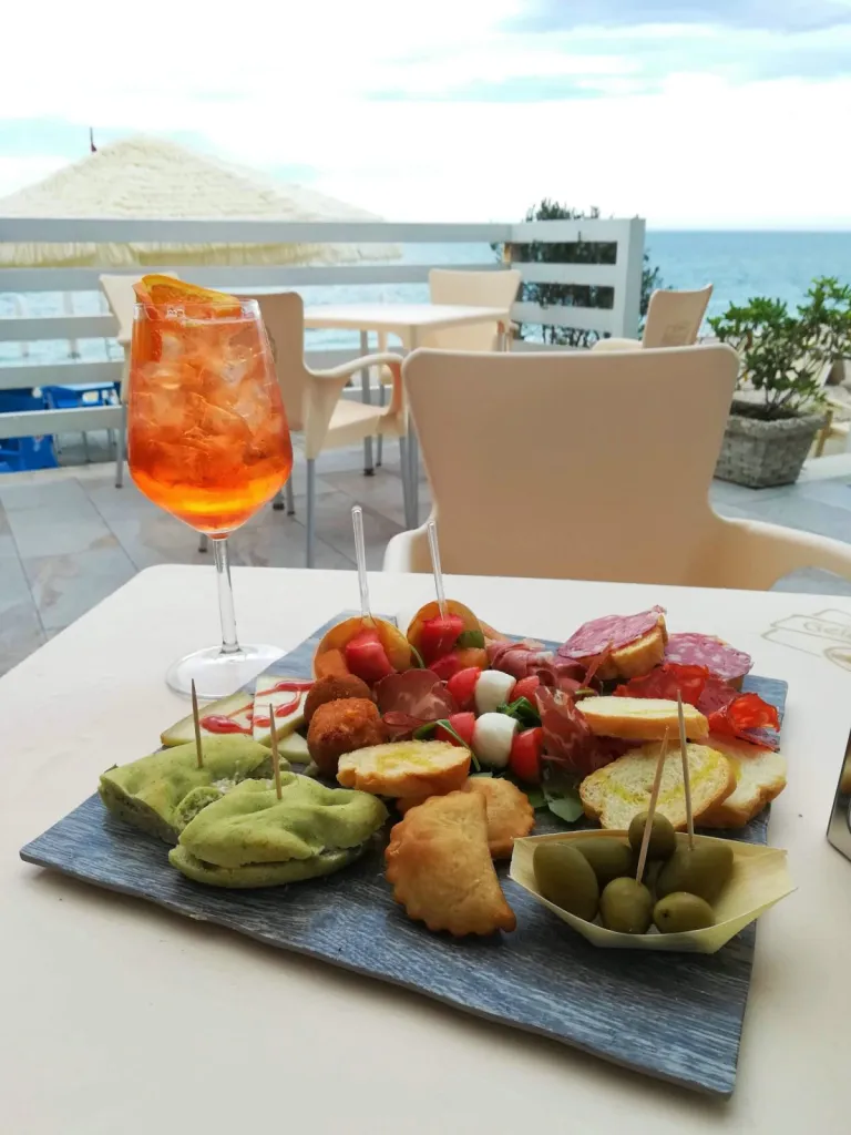 Aperol Spritz by the sea and snacks