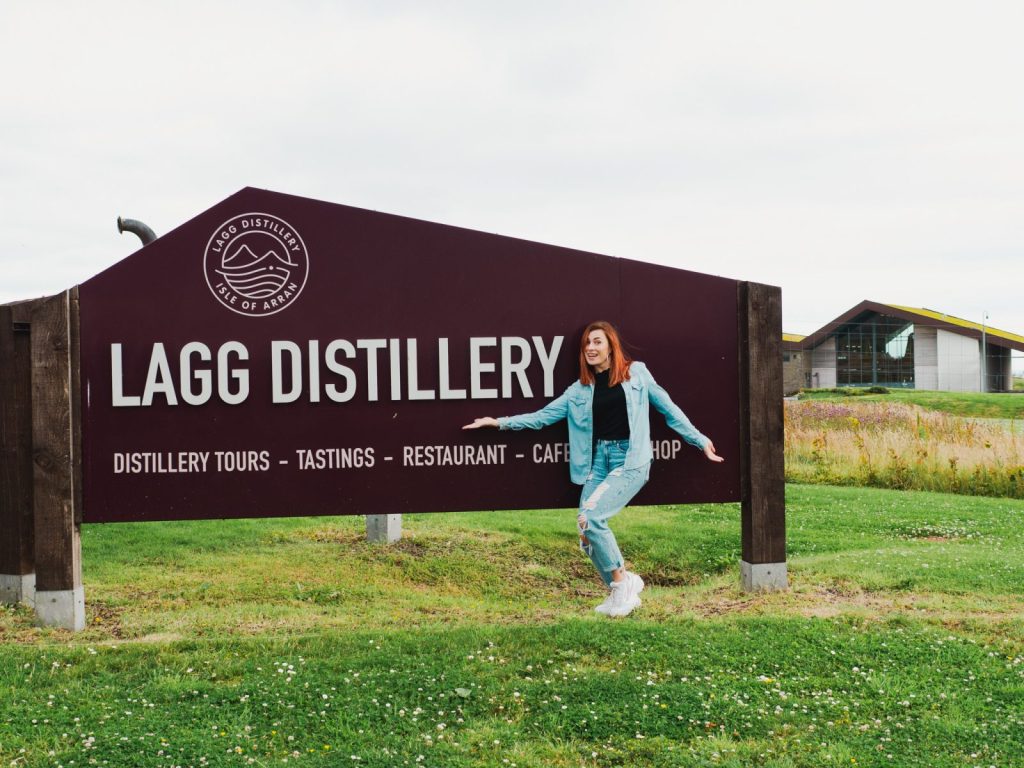 Inka Larissa at Lagaa Distillery sign