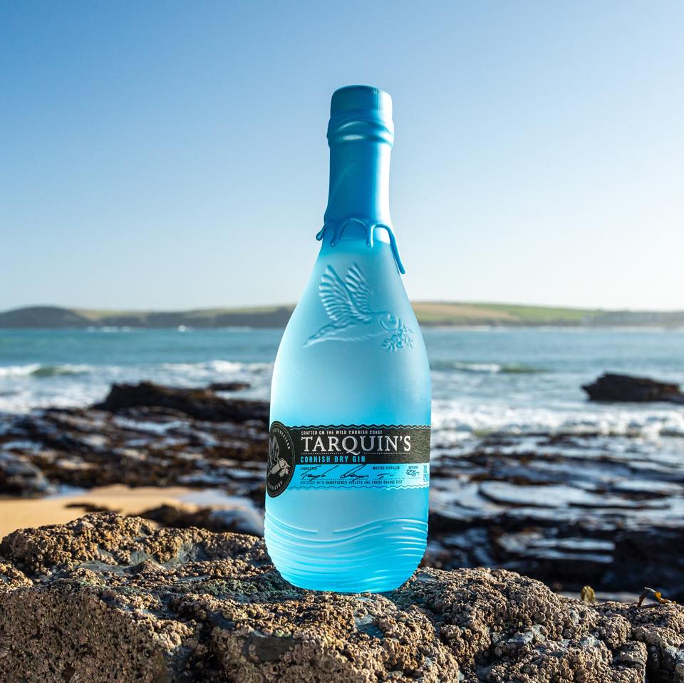 Tarquin's gin blue bottle by the sea