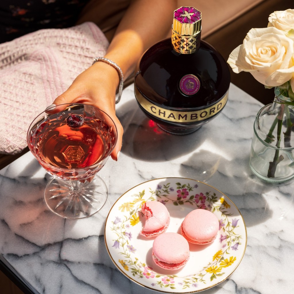 Chambord liqueur with cocktail and macaroons
