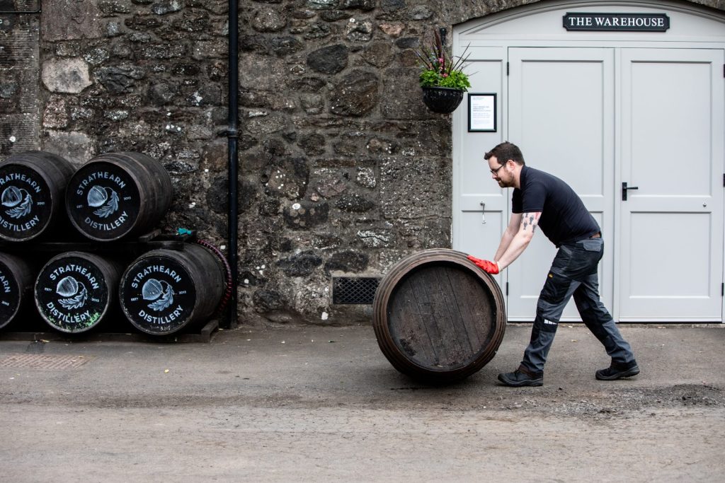 whisky casks outside their warehouse