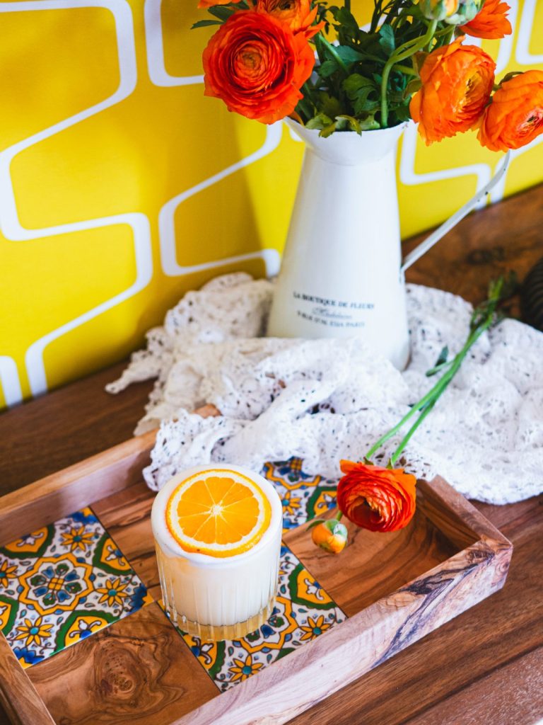 Easter whisky cocktail and flower bouquet