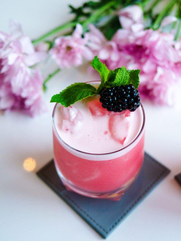 summer whisky cocktail with berries and mint