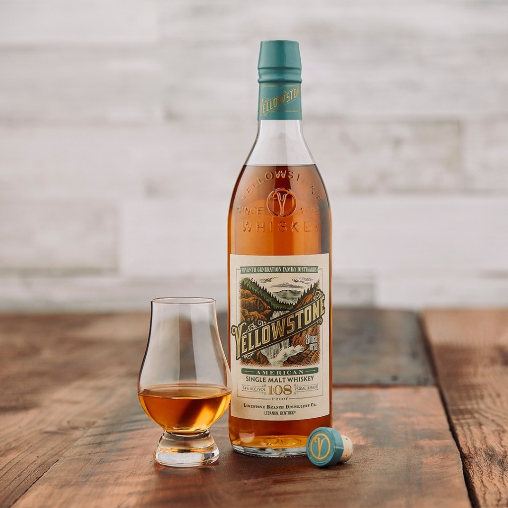 Yellowstone American single malt whiskey bottle and a tasting glass