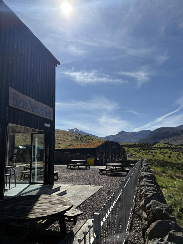 Stunning scenic views from the beer garden of Ben Nevis Inn on a sunny day.