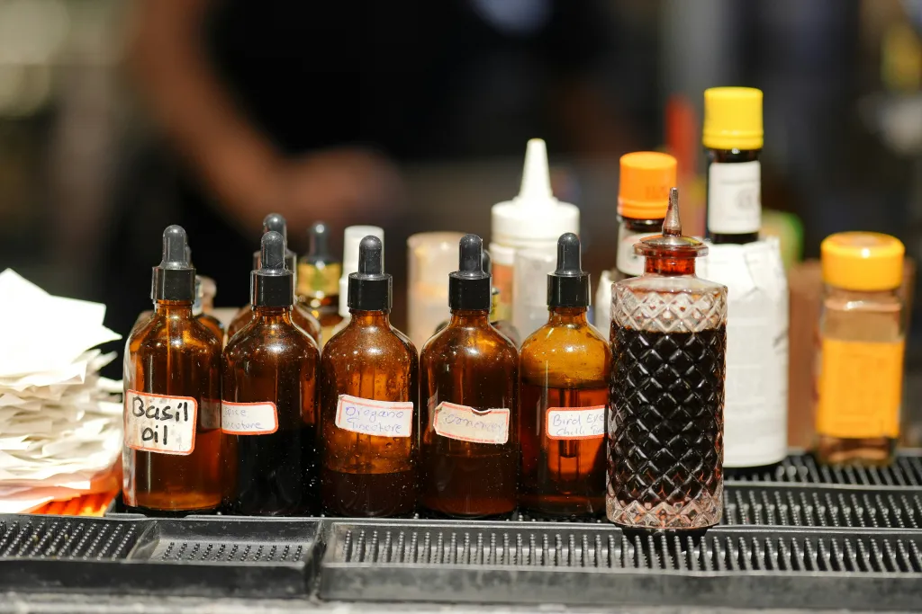 Bitters and tincture bottles lined up including Angostura bitters